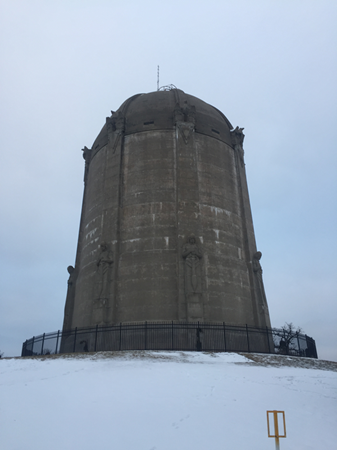 A towering stone monolith in the snow